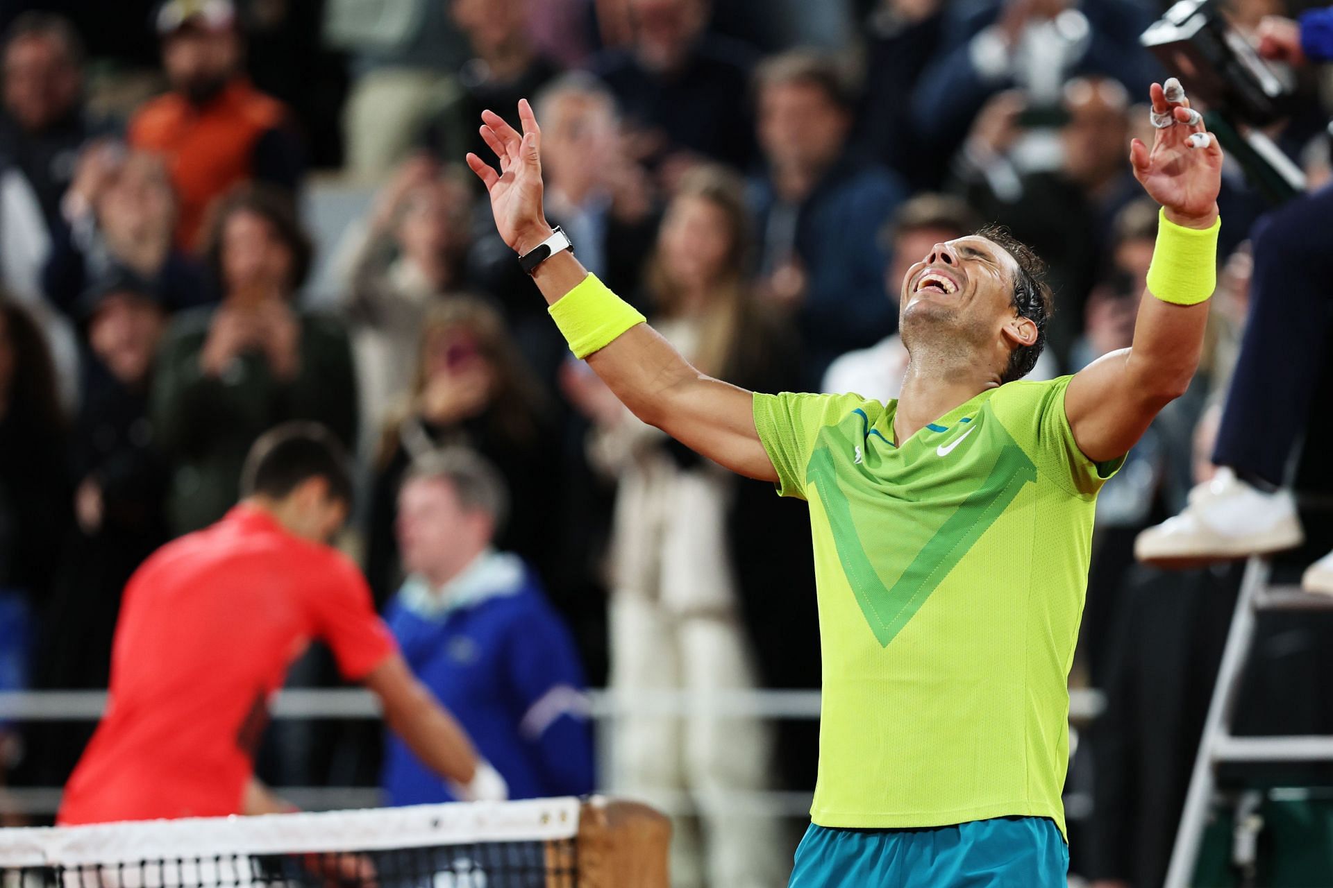 Rafael Nadal celebrates following his defeat of Novak Djokovic at the 2022 French Open