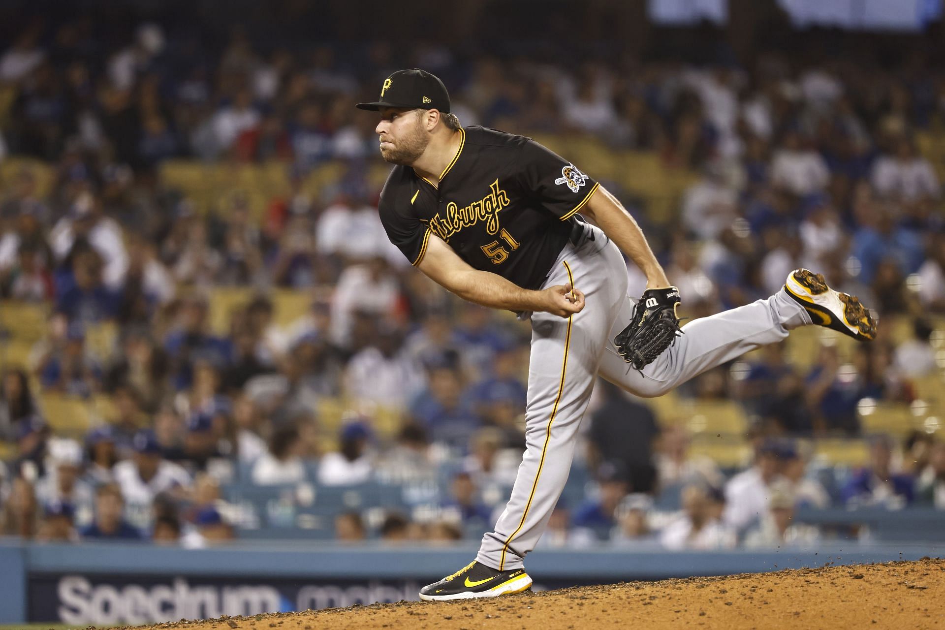 David Bednar of the Pittsburgh Pirates pitches against the Los Angeles Dodgers.