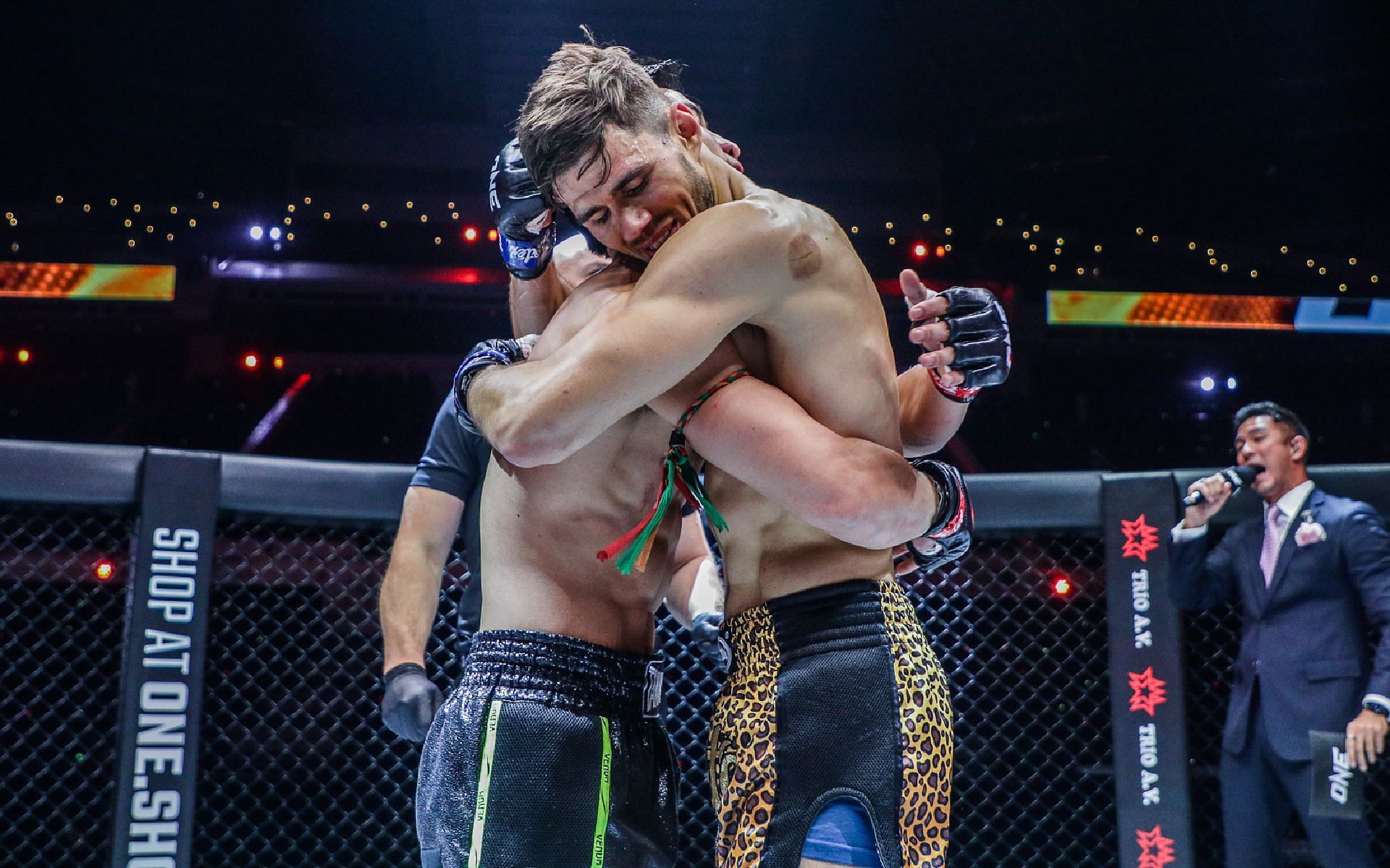 Niclas Larsen (right) shares and embrace with Tawanchai PK.Saenchai (left) after the main event on ONE 158. [Photo ONE Championship]