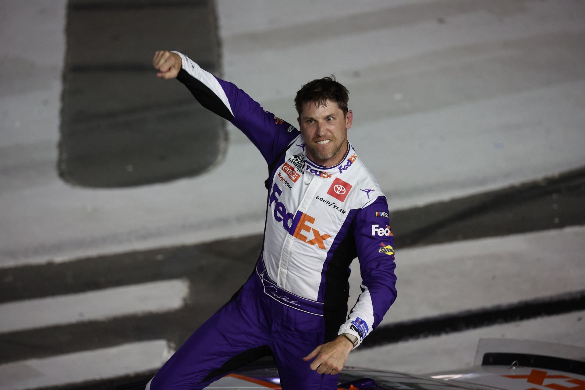 Denny Hamlin celebrates after winning the NASCAR Cup Series Coca-Cola 600 at Charlotte Motor Speedway. (Photo by James Gilbert/Getty Images)