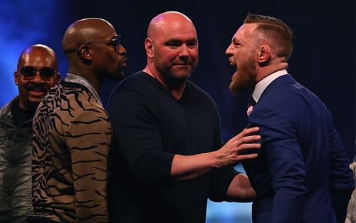 Floyd Mayweather Jr. (left), Dana White (center), Conor McGregor (right)