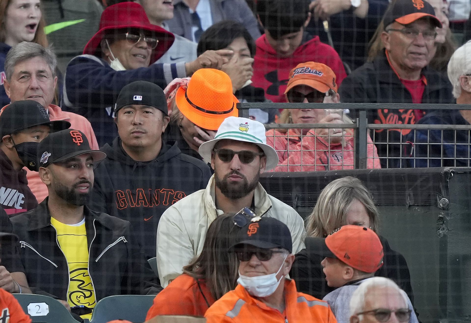 The Golden State Warriors star takes in a game at Oracle Park.