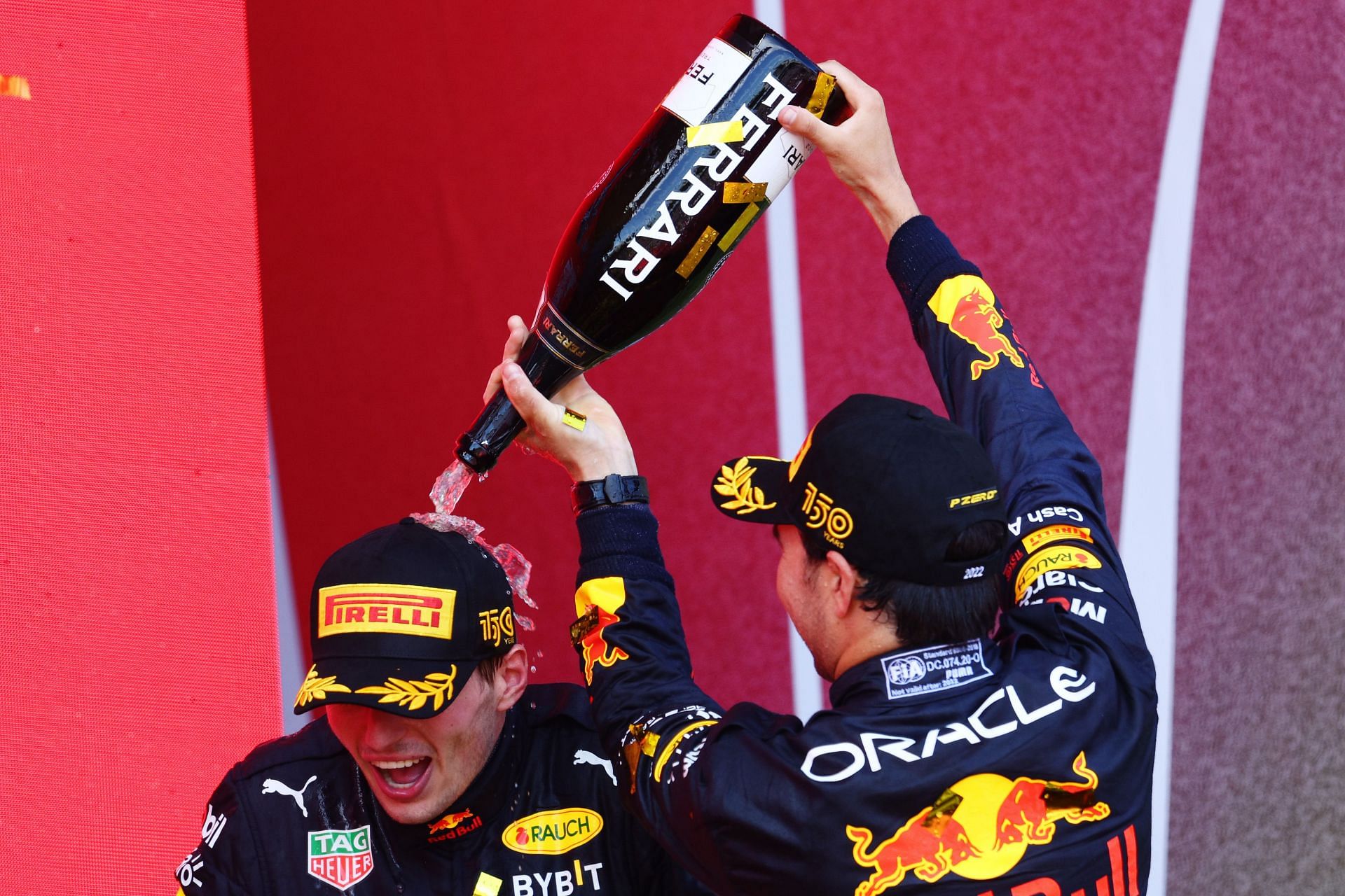 Max Verstappen (left) and Sergio Perez (right) celebrate on the podium during the 2022 F1 Grand Prix of Azerbaijan (Photo by Clive Rose/Getty Images)
