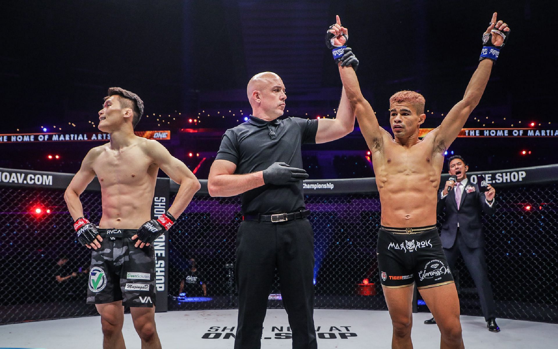 Fabricio Andrade (right) gets his hand raised after his win over Kwon Won Il (left) at ONE 158. [Photo ONE Championship]