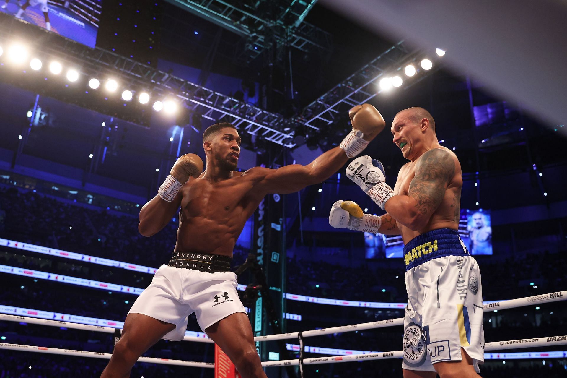 Anthony Joshua (left) during his first fight against Oleksandr Usyk (right)