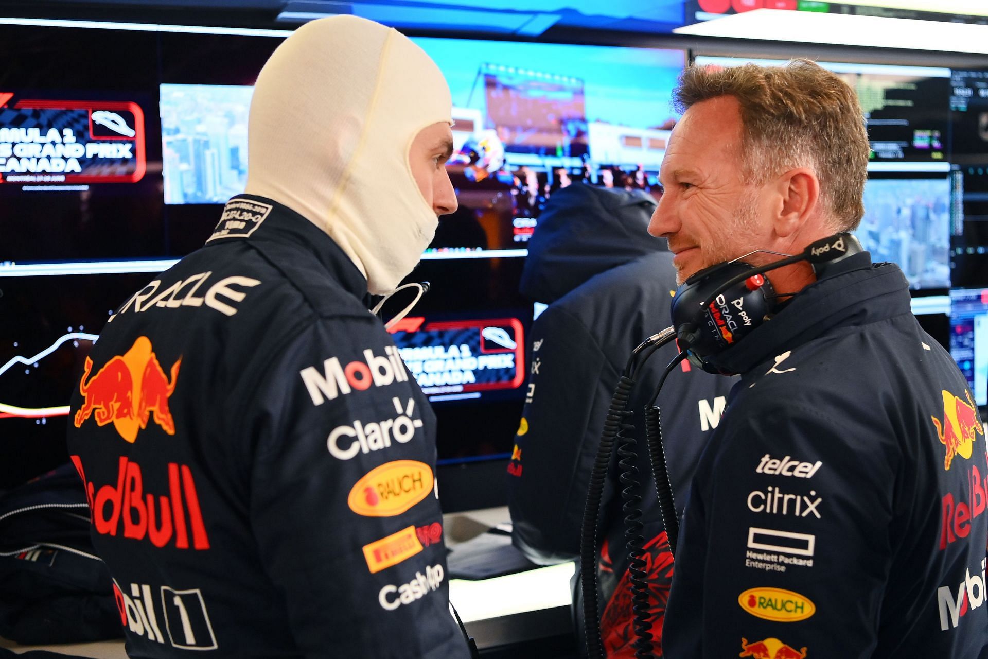Red Bull Racing team principal Christian Horner (right) talks with Max Verstappen in the garage during qualifying ahead of the 2022 F1 Grand Prix of Canada (Photo by Dan Mullan/Getty Images)