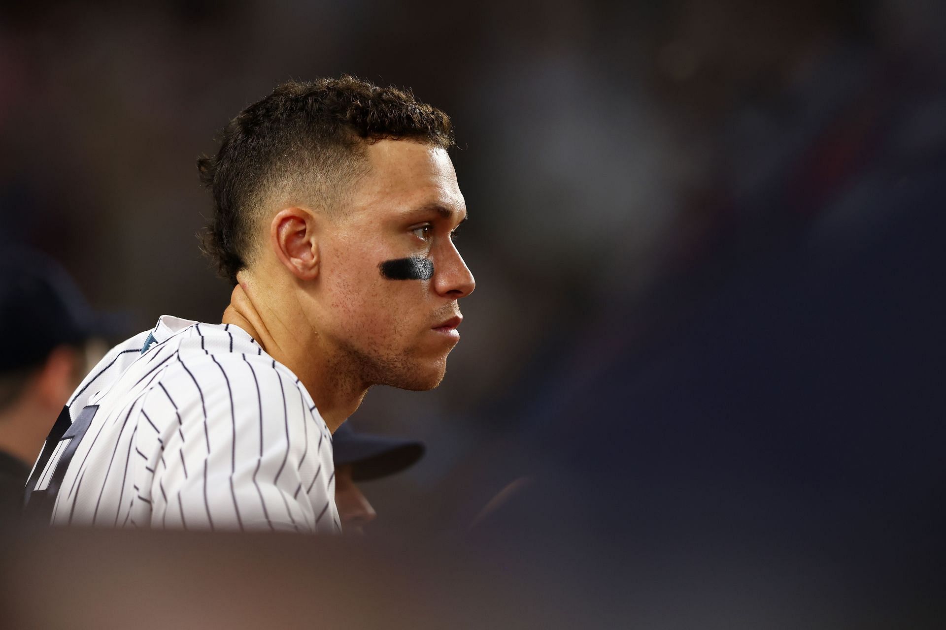 Aaron Judge looking on from the Yankees dugout