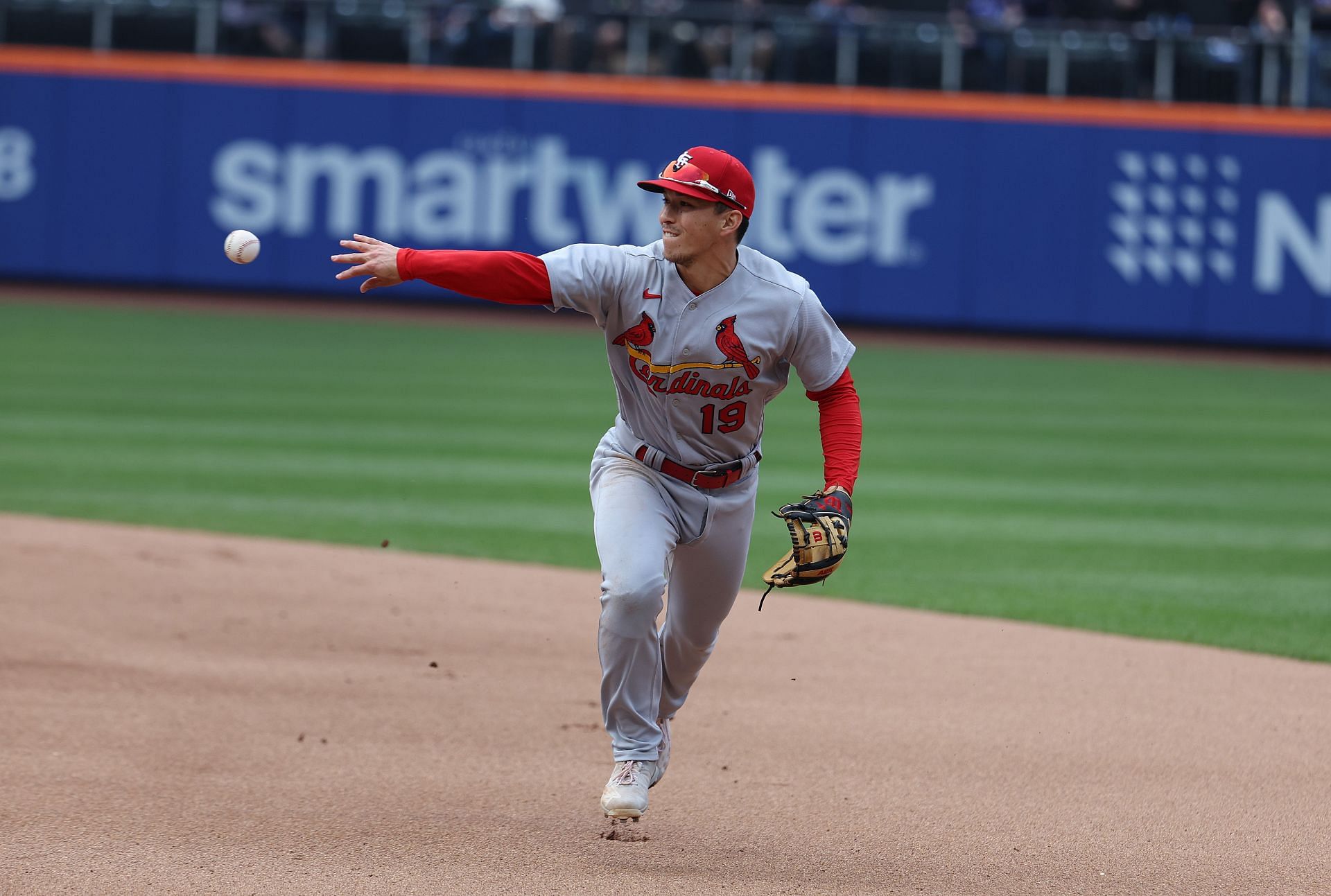 Tommy Edman throws for the out in a St. Louis Cardinals game.