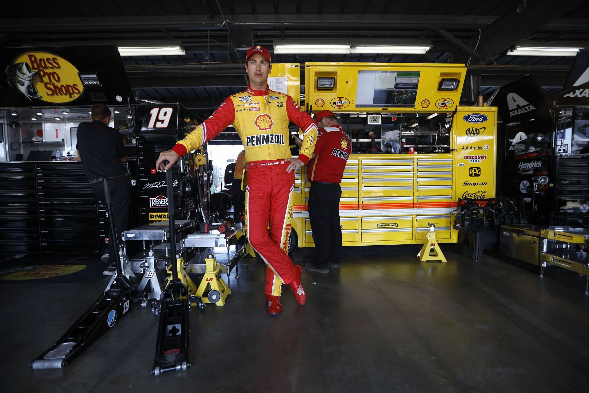 Joey Logano waits in the garage area during practice for the NASCAR Cup Series Enjoy Illinois 300 at WWT Raceway.
