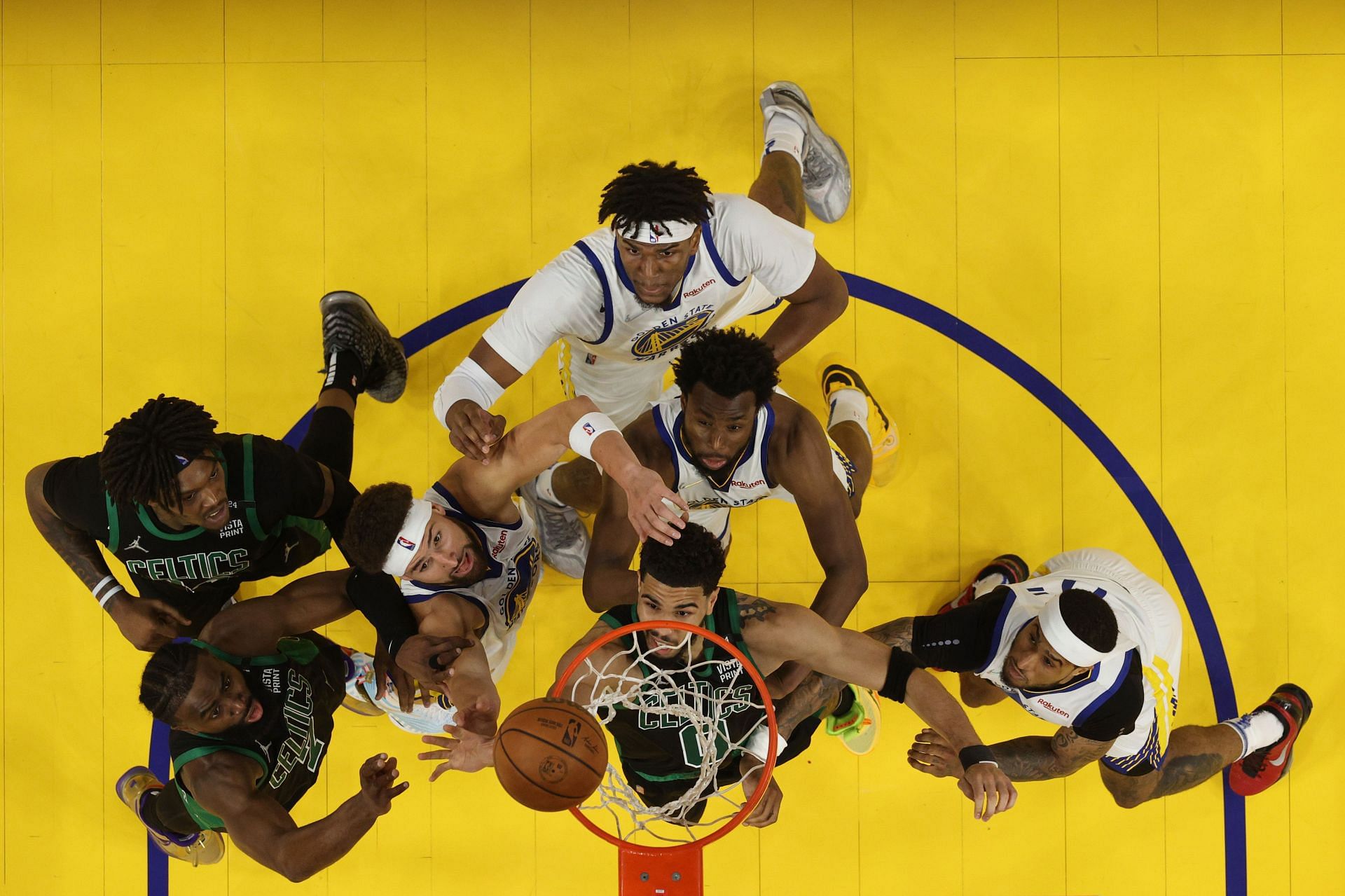 Seven of 10 players on the floor, contesting for a rebound.