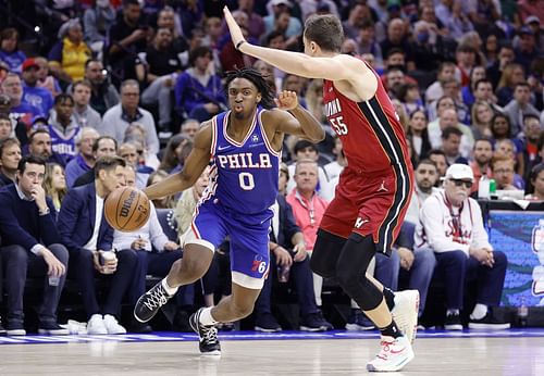 Tyrese Maxey taking on Miami Heat's Duncun Robinson