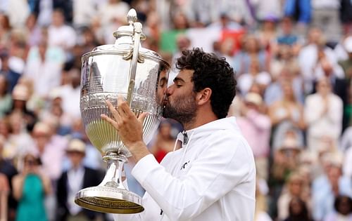 Matteo Berrettini holds aloft the trophy at the Cinch Championships