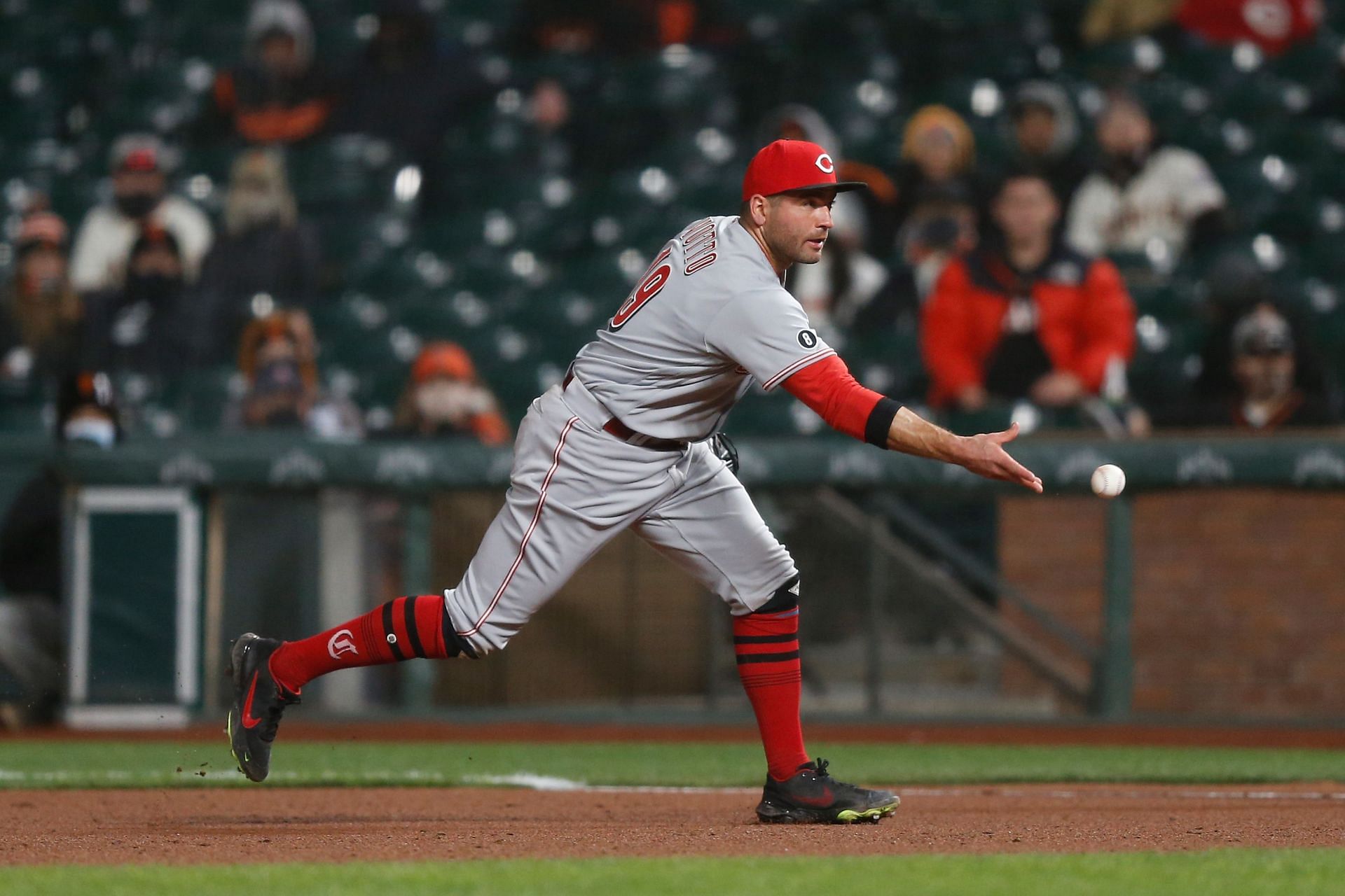 Joey Votto tosses a ground ball he fielded to pitcher Graham Ashcraft in last night&#039;s Cincinnati Reds v San Francisco Giants game.