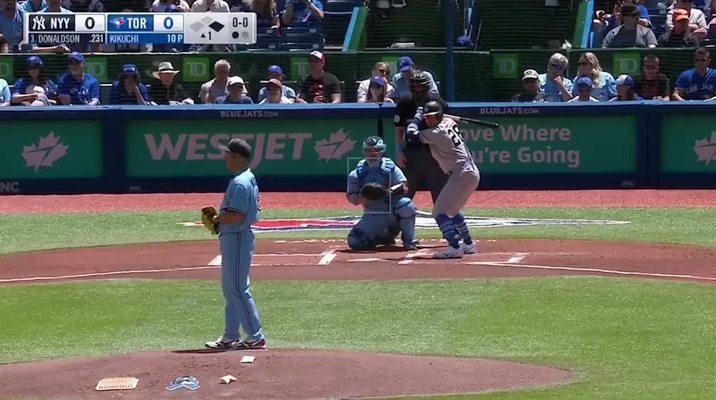 Josh Donaldson #20 of the Toronto Blue Jays puts on his helmet as