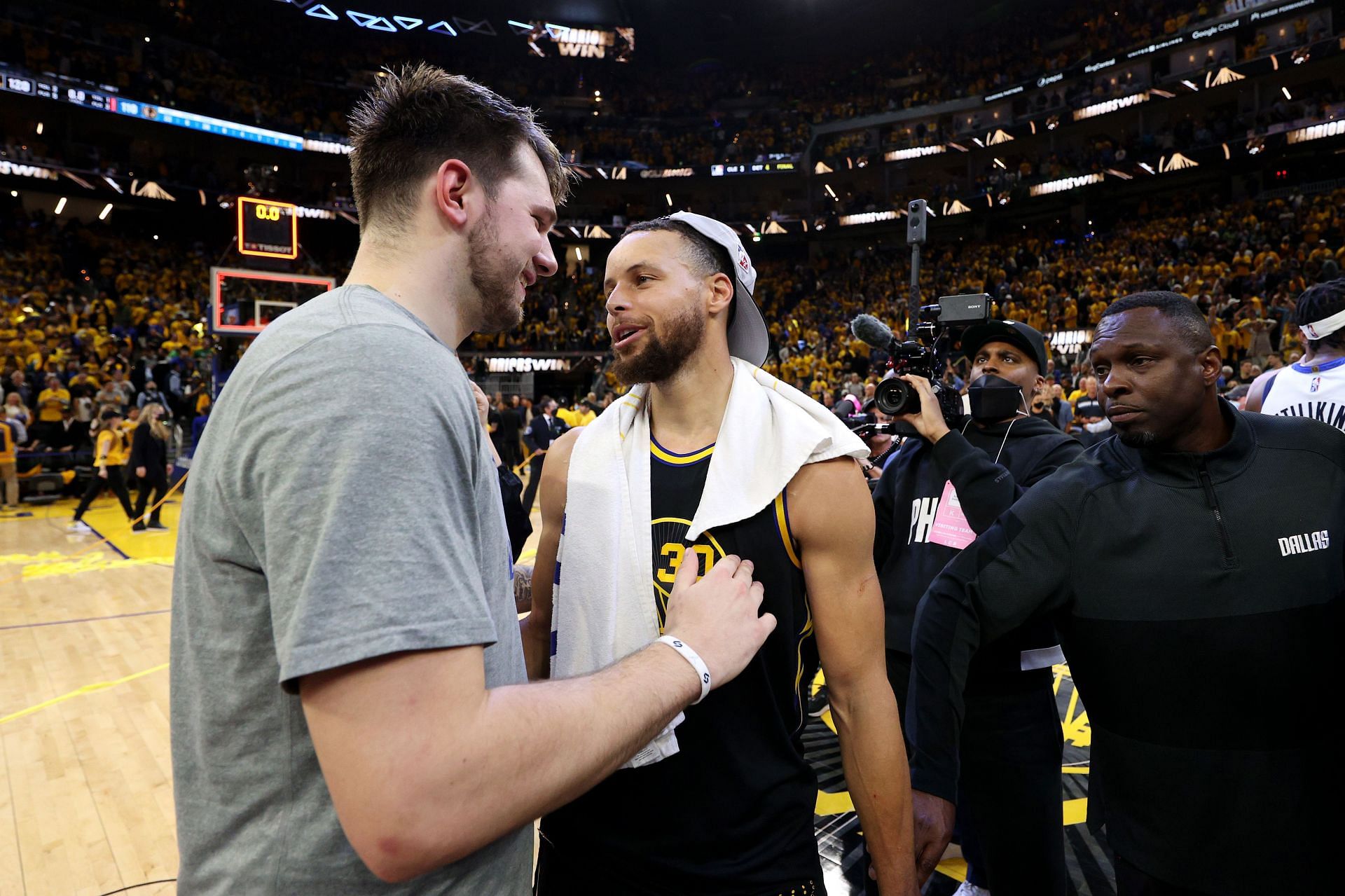 Steph Curry of the Golden State Warriors talks with Luka Doncic of the Dallas Mavericks after Game 5 of the 2022 NBA Western Conference Finals