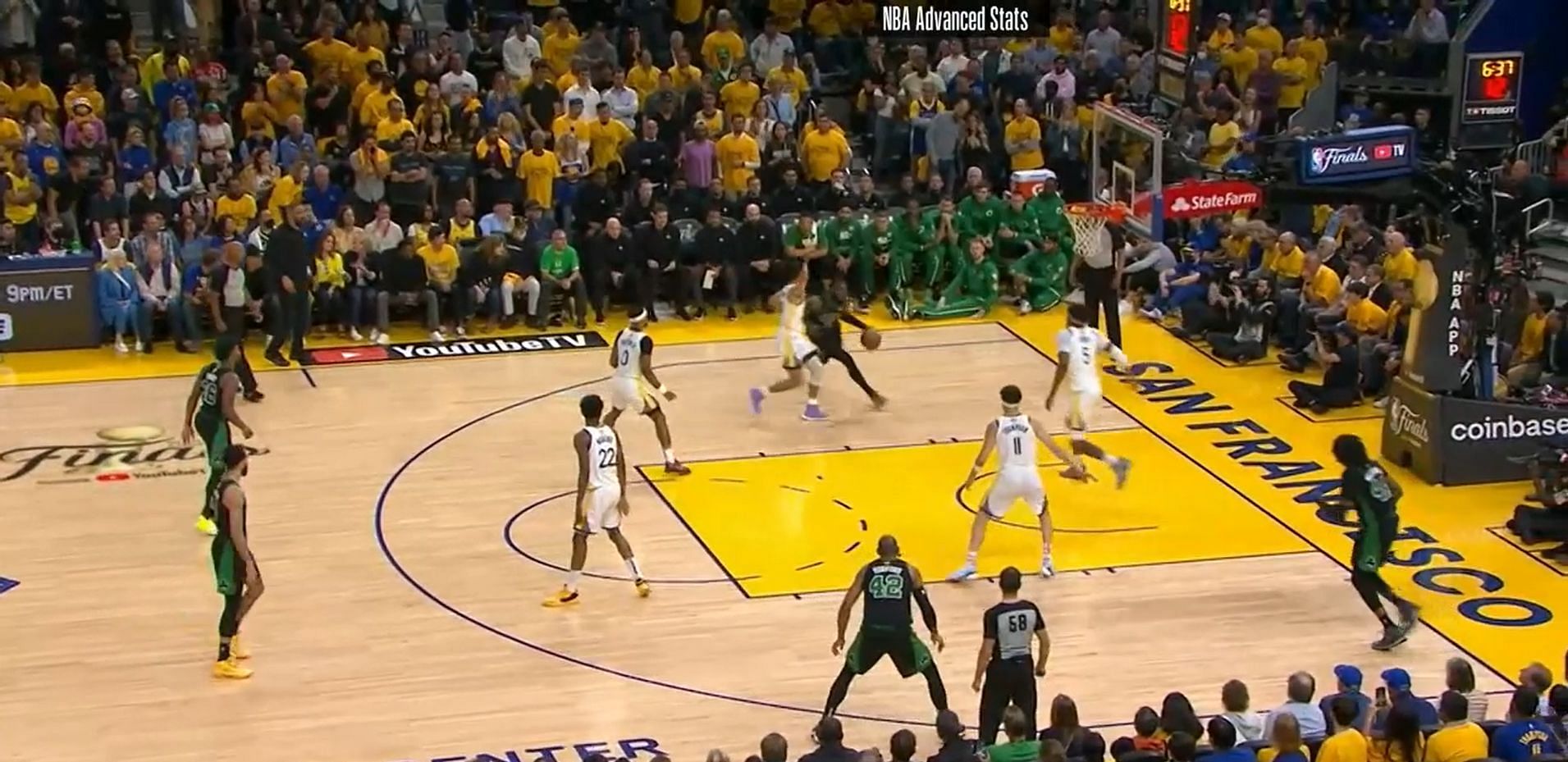 Curry pressures Brown&#039;s right hand as Looney moves in.