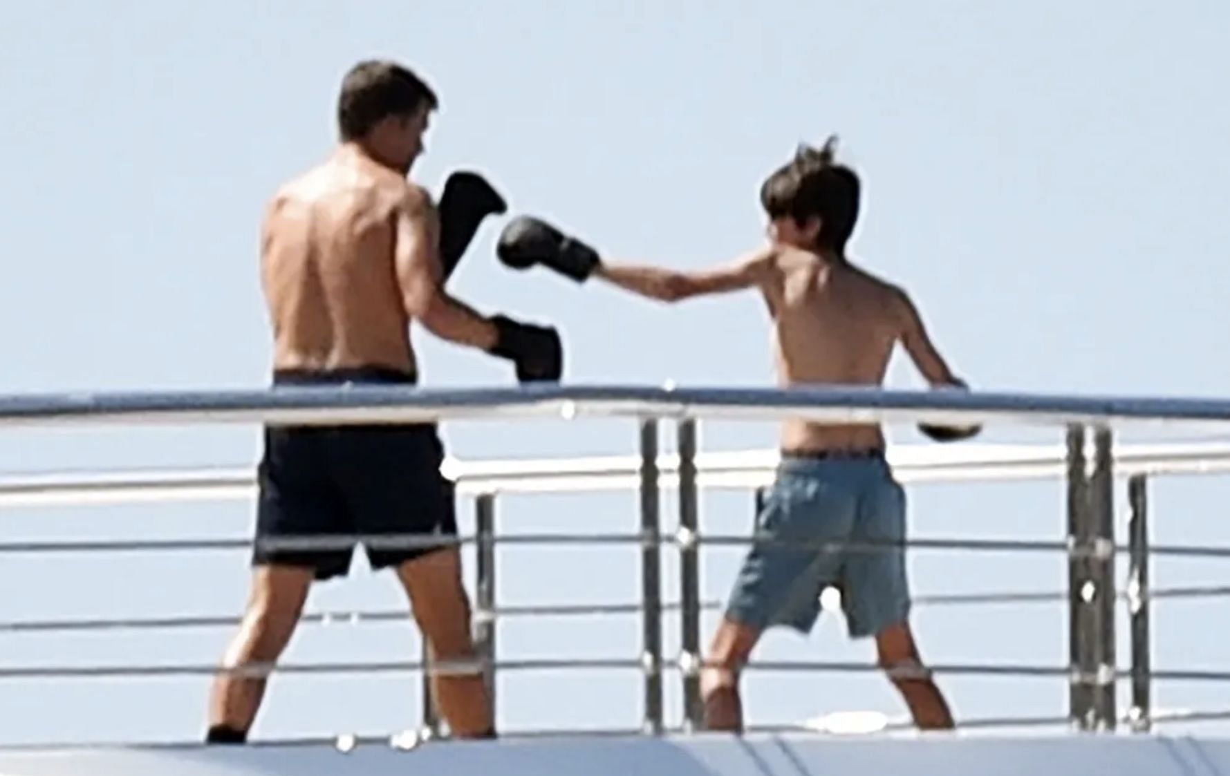 Brady sparring with one of his sons on the yacht. Source: TMZ