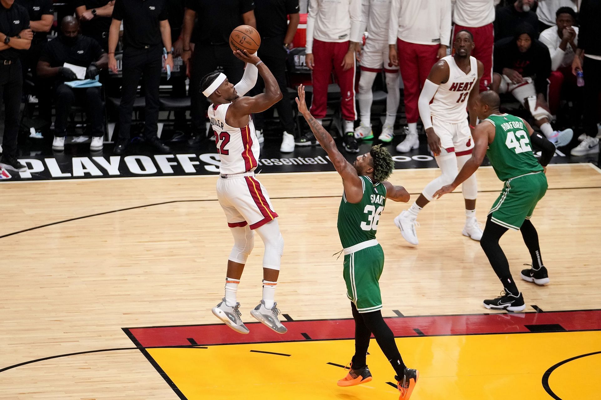 Boston Celtics v Miami Heat - Game Seven; Jimmy Butler shoots over Marcus Smart