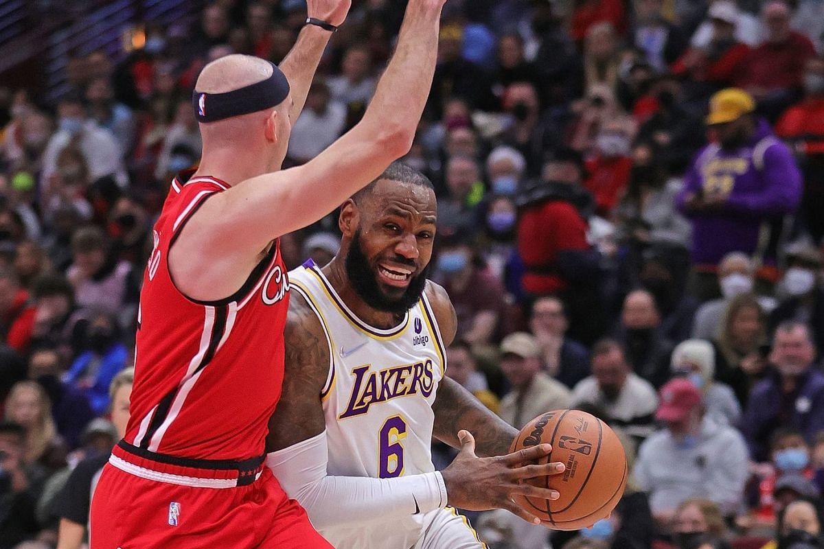 LeBron James and Alex Caruso in action during LA Lakers v Chicago Bulls game. [Source Fadewaway World]