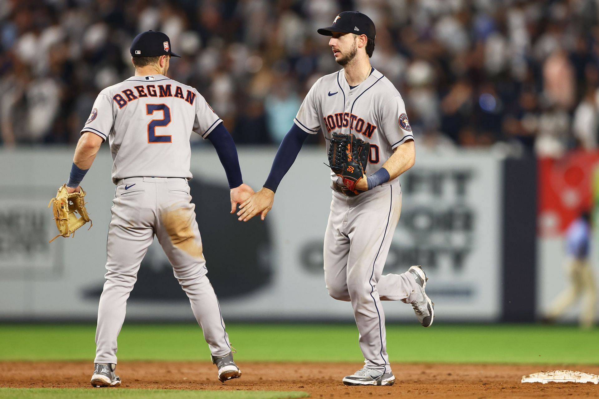 Alex Bregman and Kyle Tucker celebrate after beating the New York Yankees Friday night.