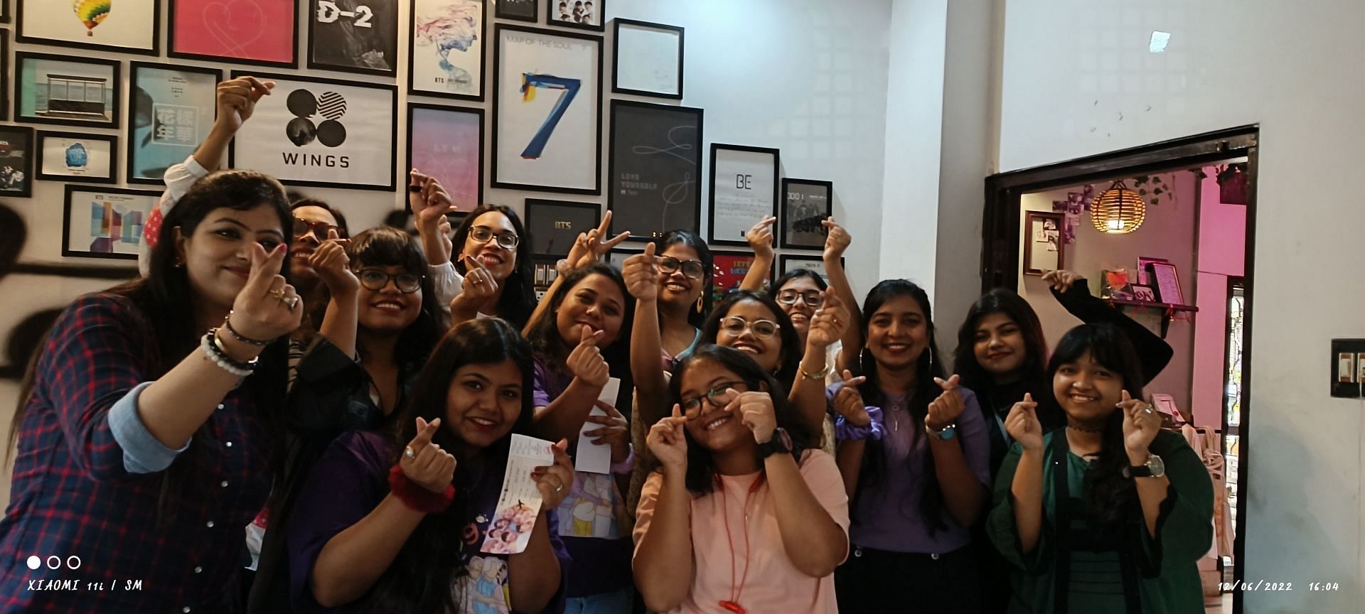 Kolkata ARMY posing at the group&#039;s 9th Anniversary event (Image via Hallyuism)