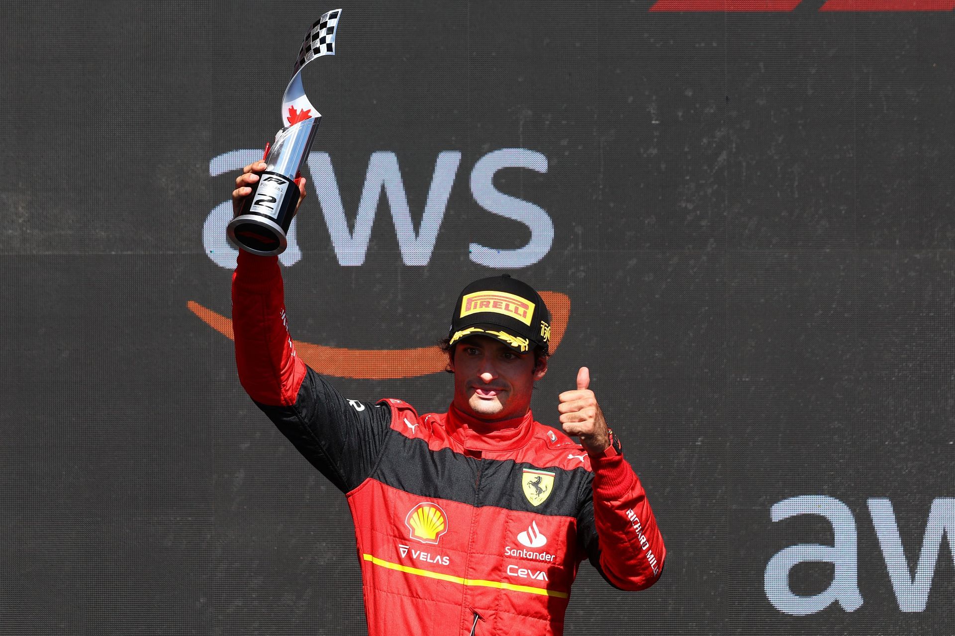 Ferrari&#039;s Carlos Sainz holds aloft the second-place trophy on the podium at the 2022 F1 Canadian GP(Photo by Clive Rose/Getty Images)