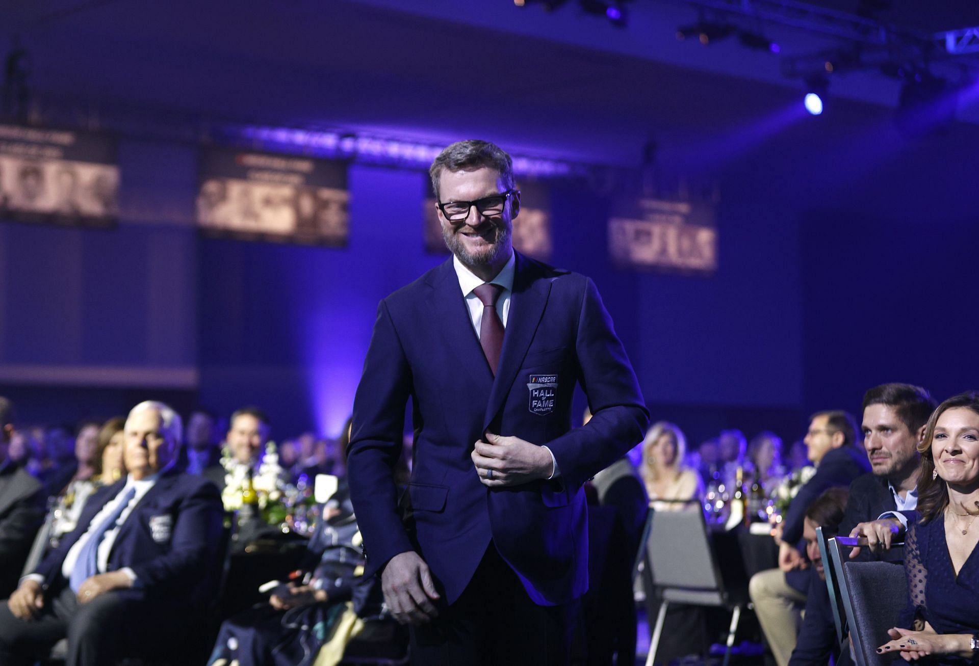 NASCAR Hall of Fame inductee Dale Earnhardt Jr. walks onto the stage during the induction ceremony