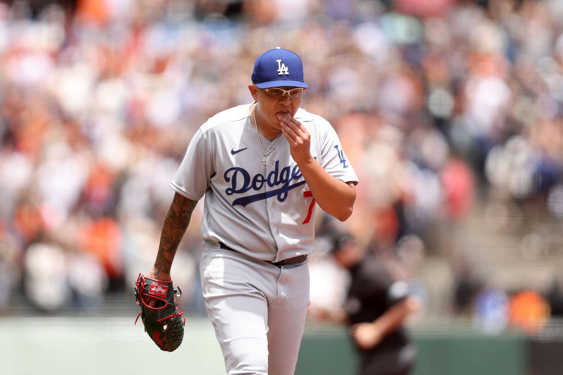 Los Angeles Dodgers pitcher Julio Urias walks off the field during the game against the San Francisco Giants.