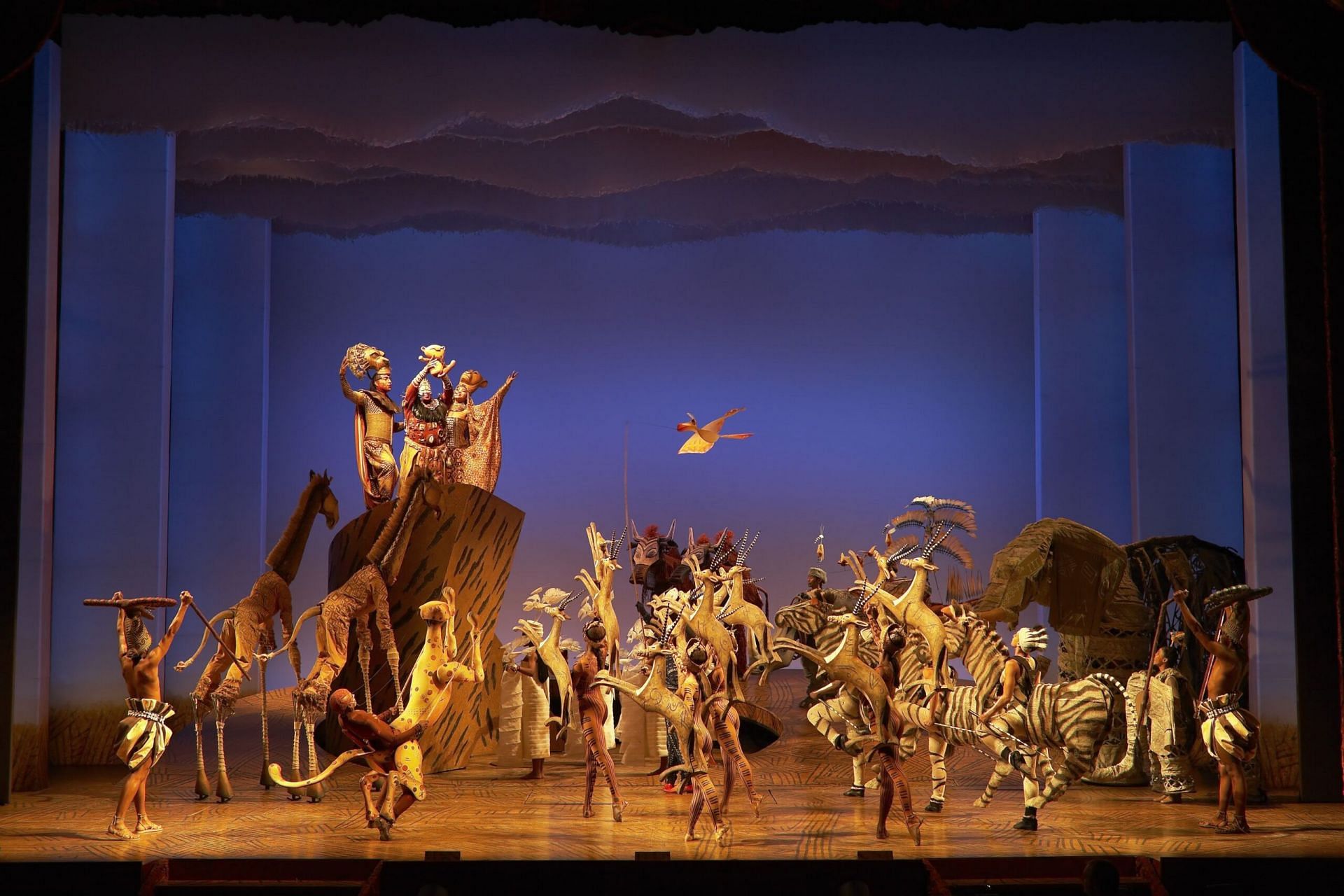 The cast of The Lion King musical performing The Circle of Life (Image via Brinkhoff-Moegenburg)