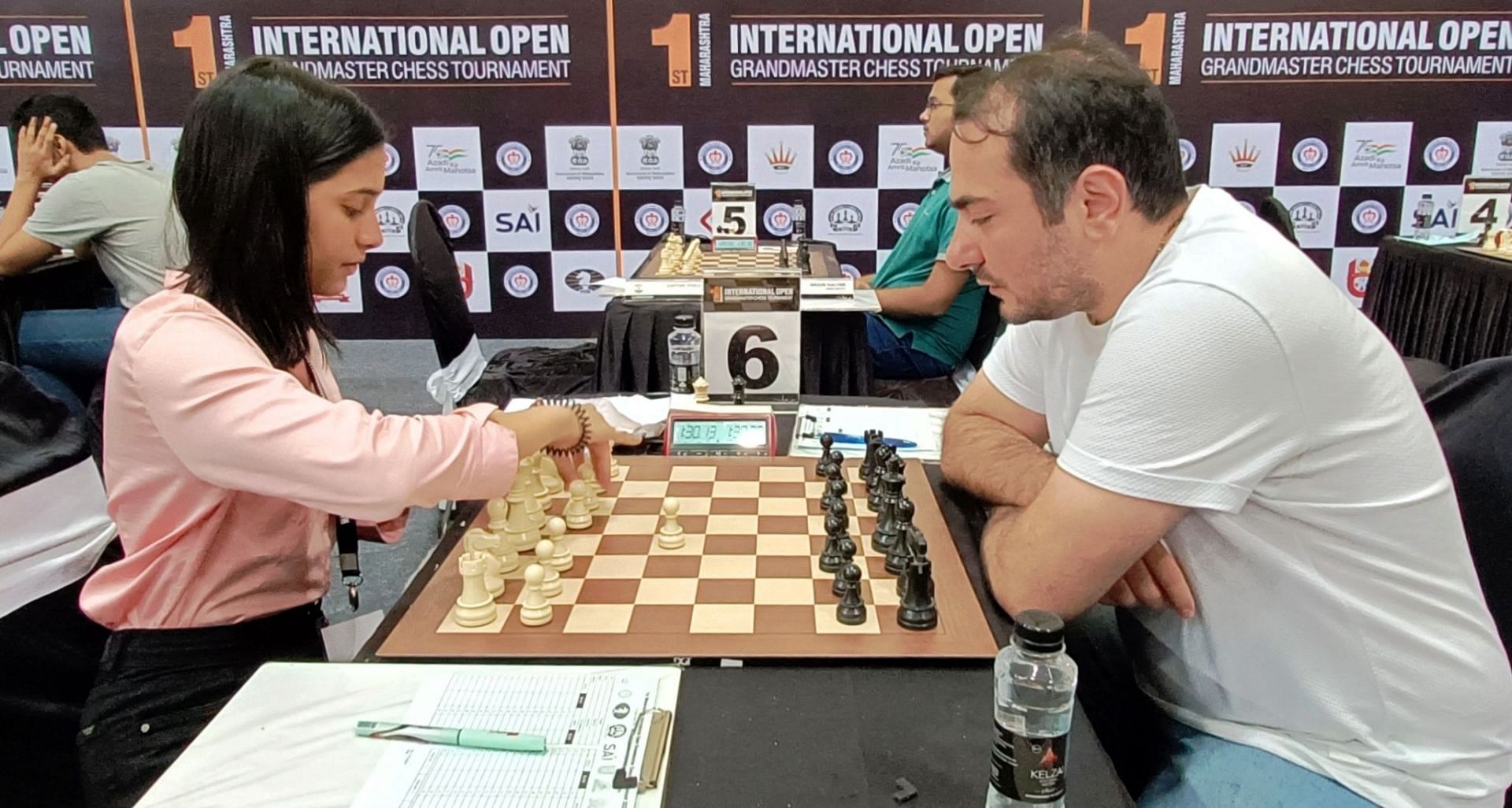 WGM Divya Deshmukh of Nagpur (L) plays against GM Paichadz Luka in the 9th round of the chess meet. (Pic credit: AICF)