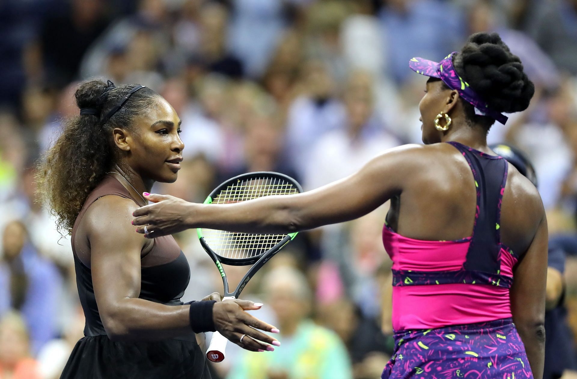 Venus and Serena Williams in action at the 2018 US Open