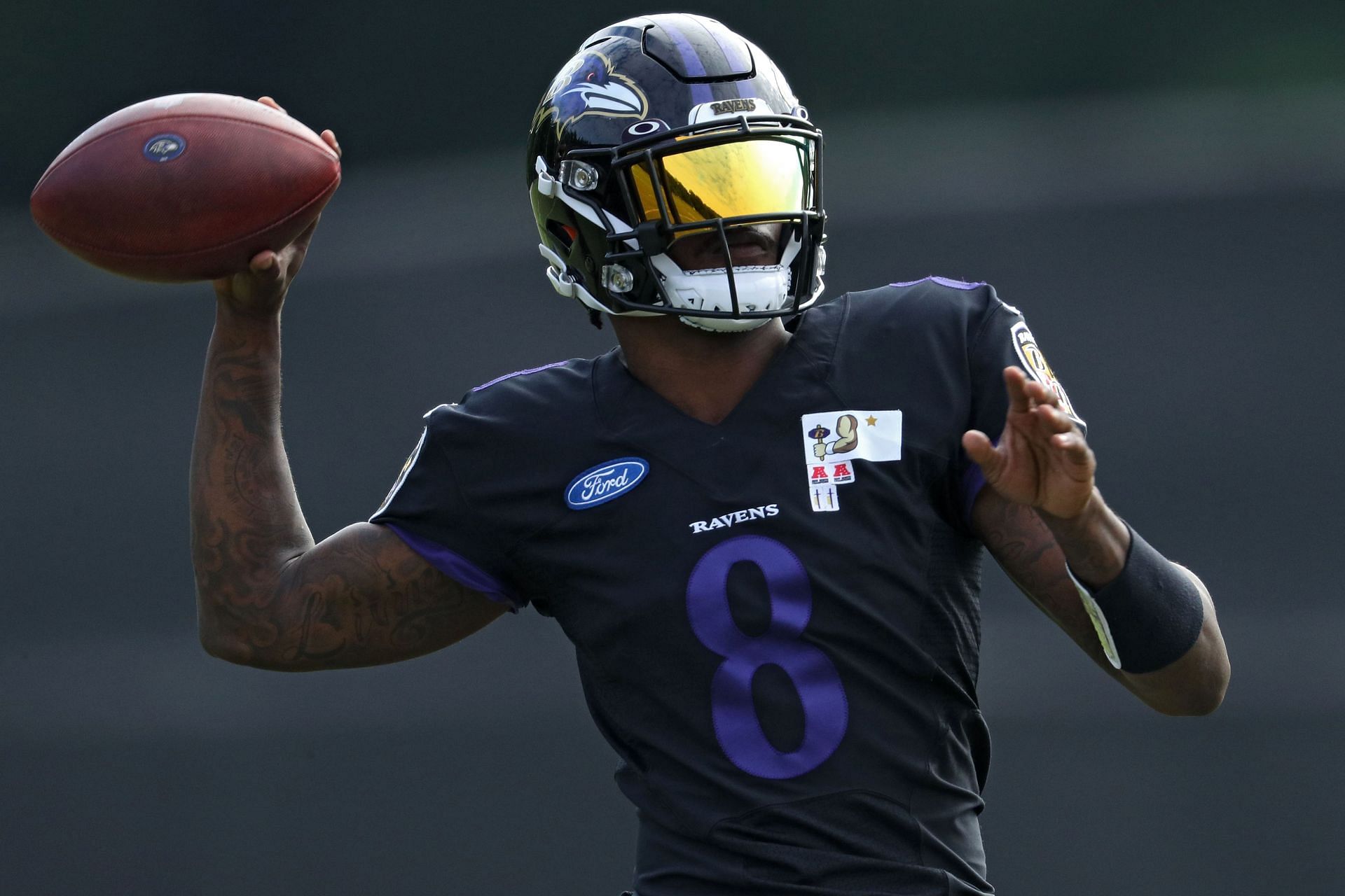 Baltimore Ravens quarterback Lamar Jackson drops back to pass