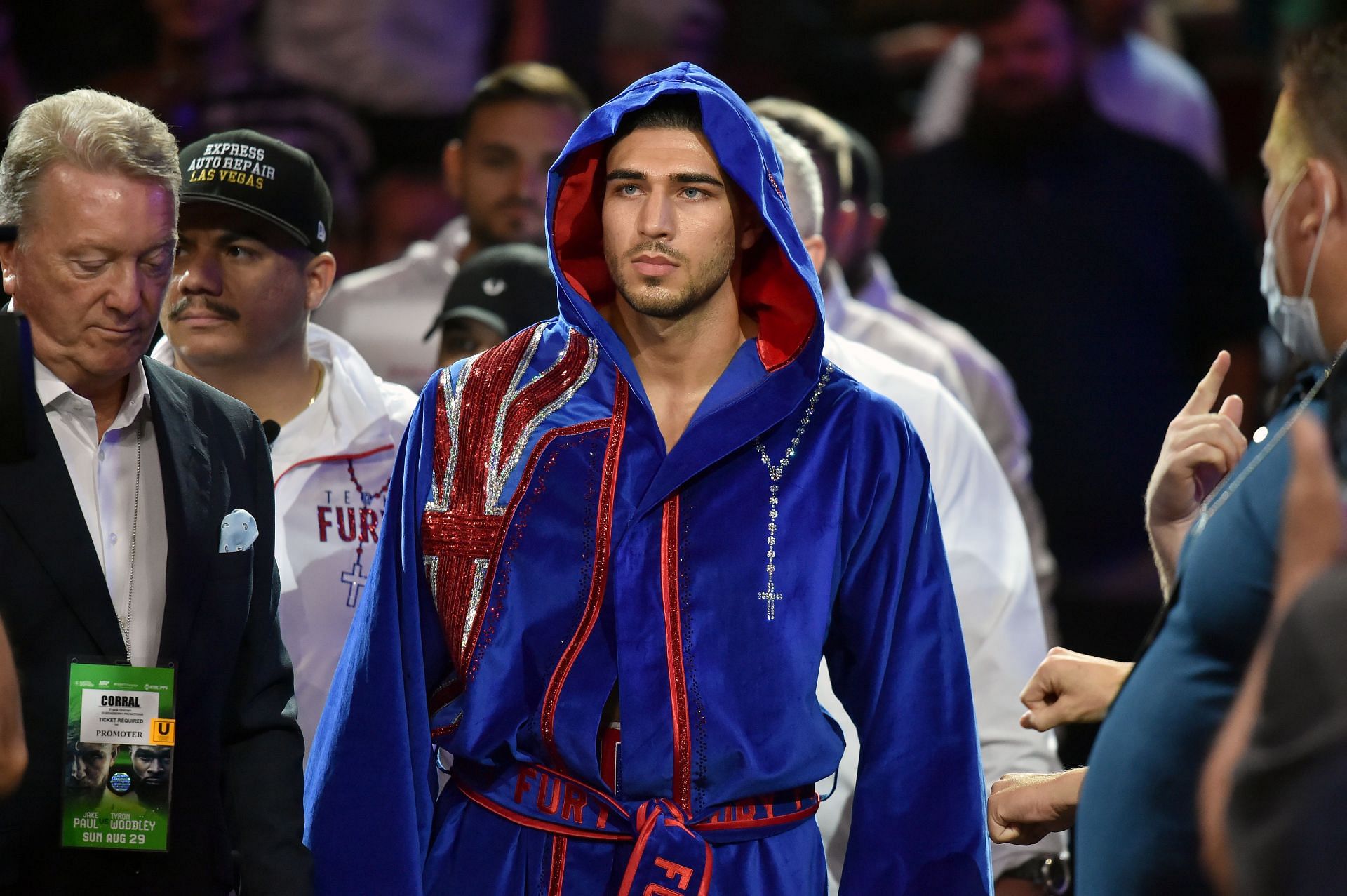 Tommy Fury wearing a robe with the flag of Great Britain as he entered the ring to face Anthony Taylor.