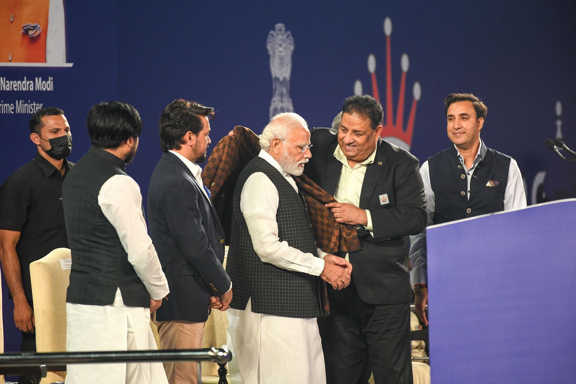 All India Chess Federation secretary Bharat Singh Chauhan felicitating Prime Minister Narendra Modi as other officials look on in New Delhi during Chess Olympiad Torch Relay. (Pic credit: AICF)
