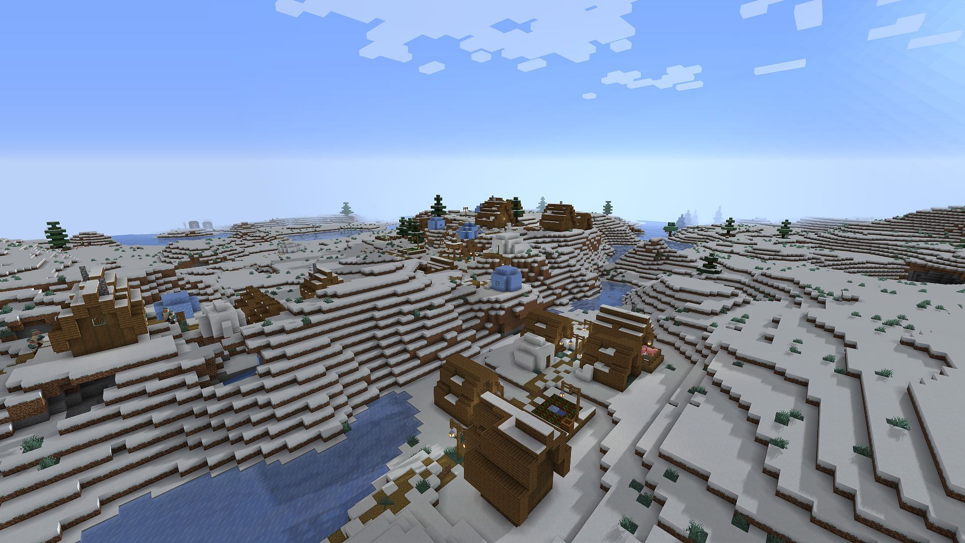 The snowy village the player spawns next to (Image via Minecraft)
