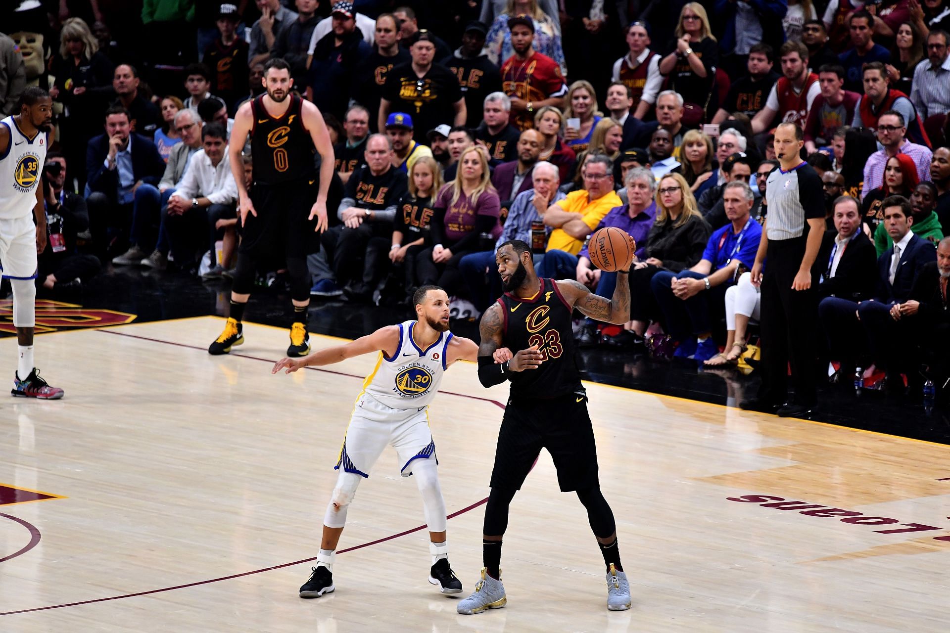 LeBron James of the Cleveland Cavaliers defended by Stephen Curry.