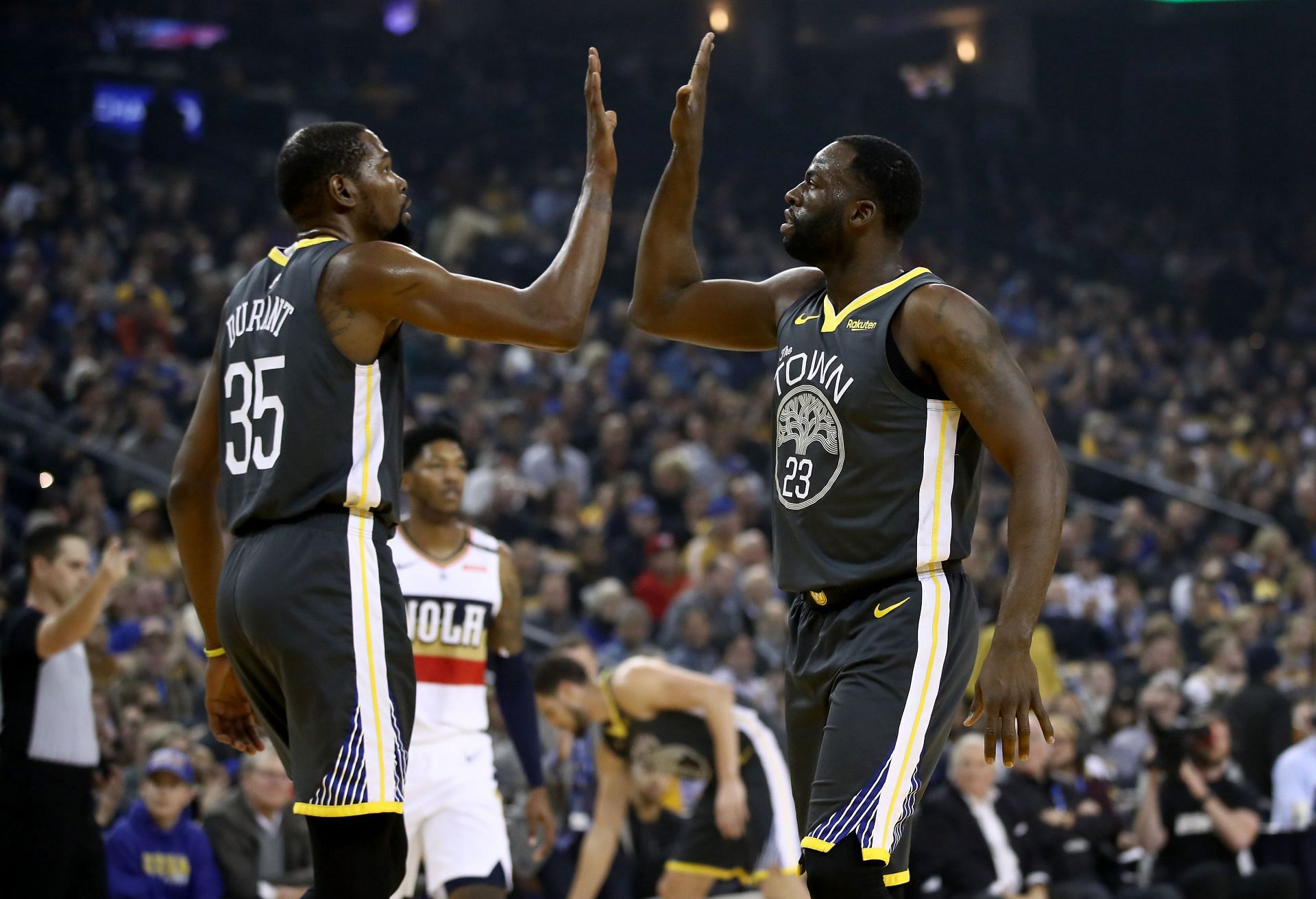 Draymond Green and Kevin Durant celebrate a play
