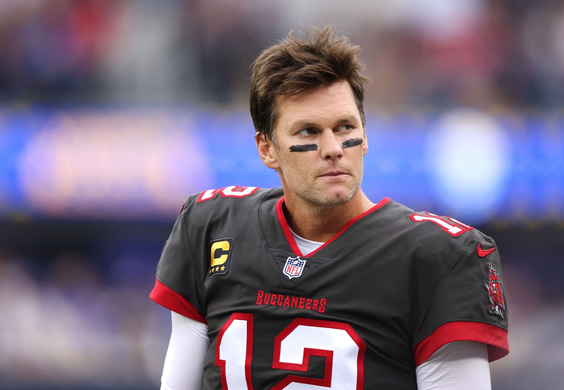 Tampa Bay Buccaneers quaterback Tom Brady seriously surveys the field