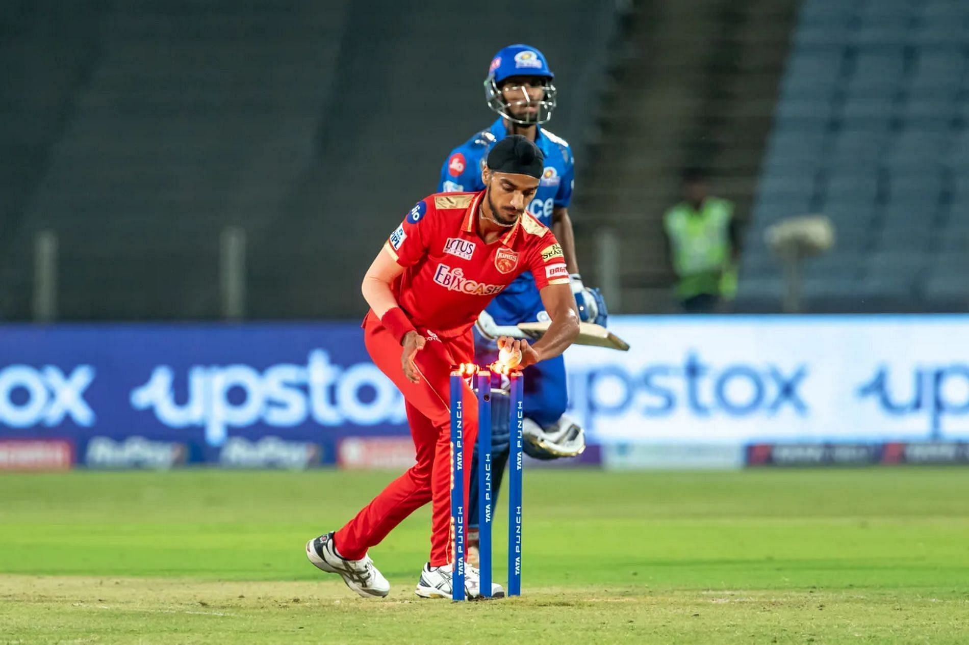 Punjab Kings' Arshdeep Singh runs out Mumbai Indians' Tilak Verma in the 2022 IPL