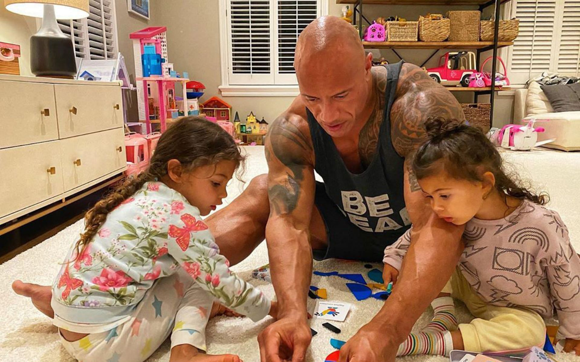 The Rock with his two daughters