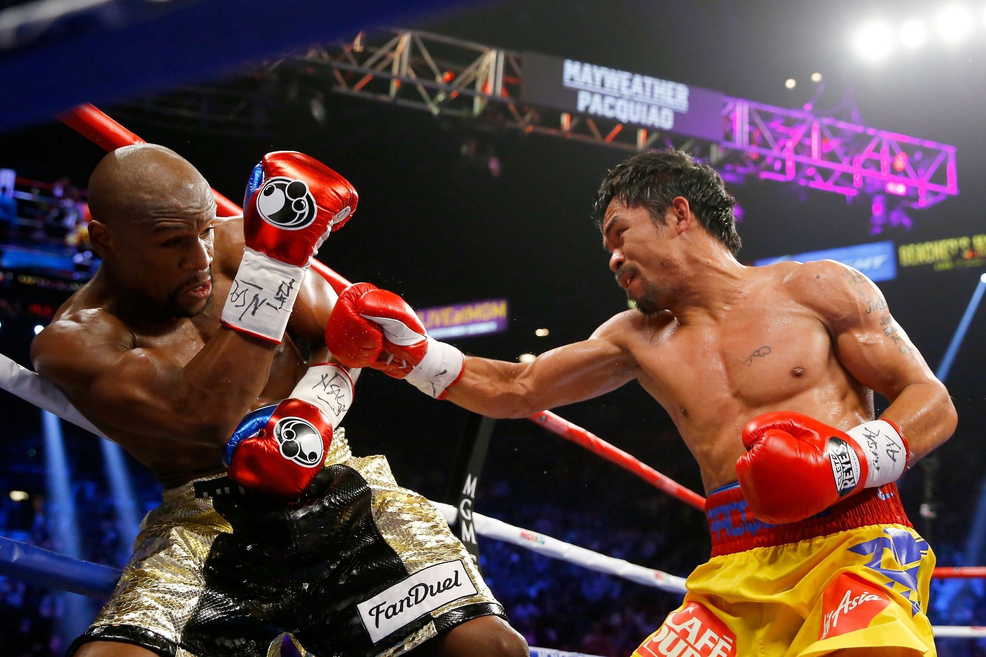 Manny Pacquiao (right) and Floyd Mayweatehr Jr. (left) fought in a match dubbed as &quot;The Fight of the Century&quot; on May 2, 2015 at MGM Grand Garden Arena in Las Vegas, Nevada. (Photo by Al Bello/Getty Images)