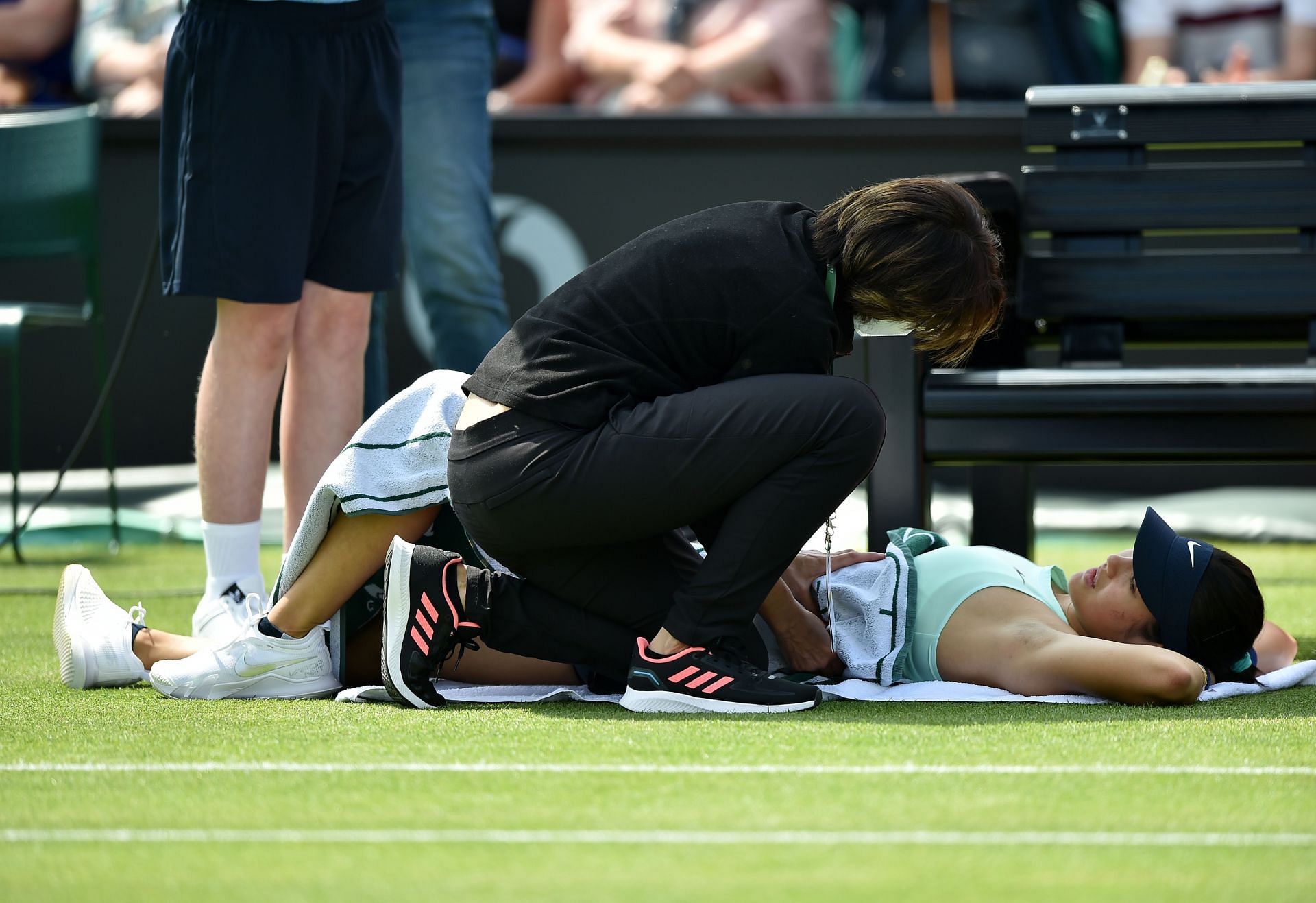 Emma Raducanu receives treatment during her match at the Rothesay Open in Nottingham