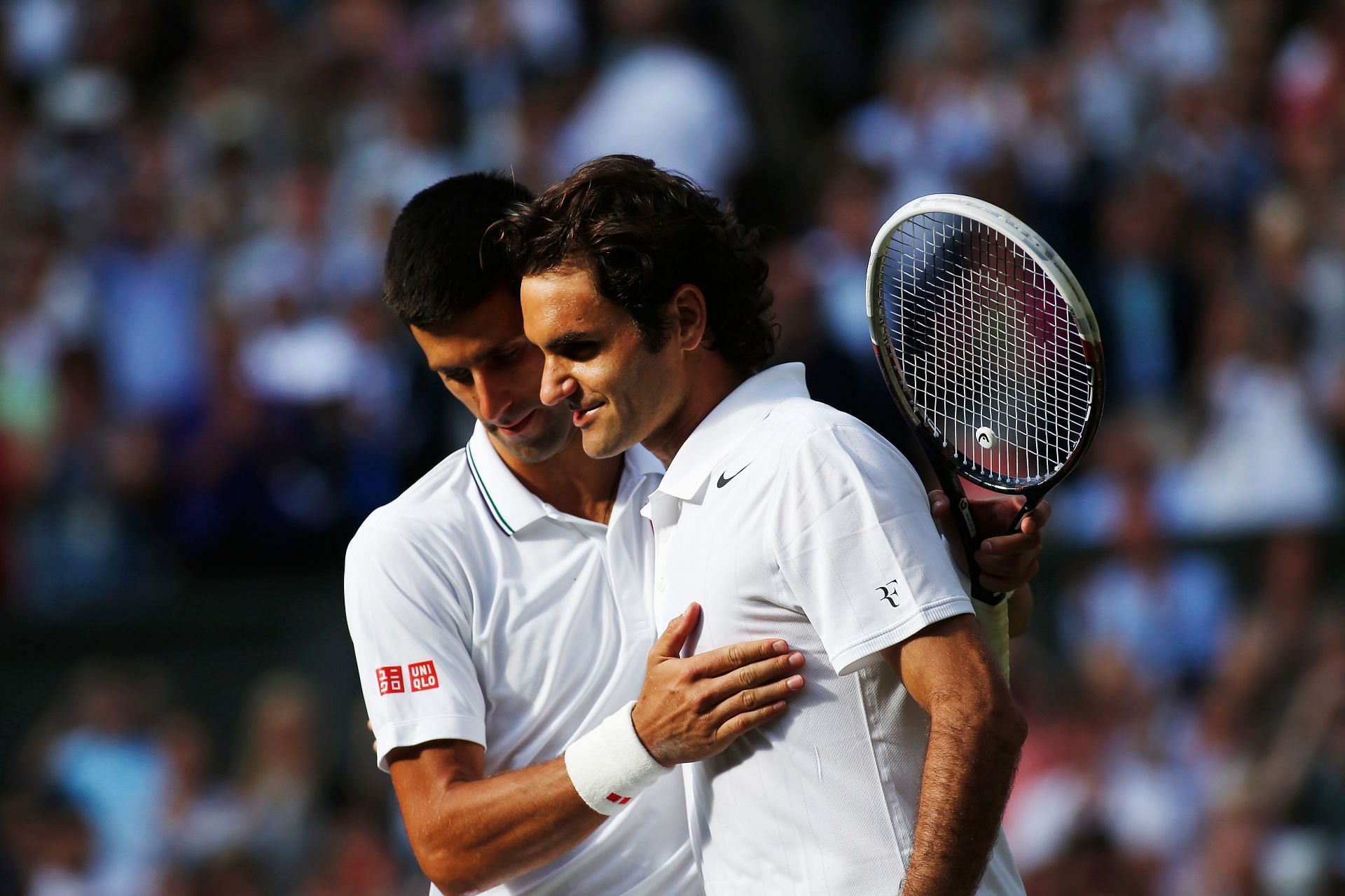 Novak Djokovic and Roger Federer after the 2014 Wimbledon final.