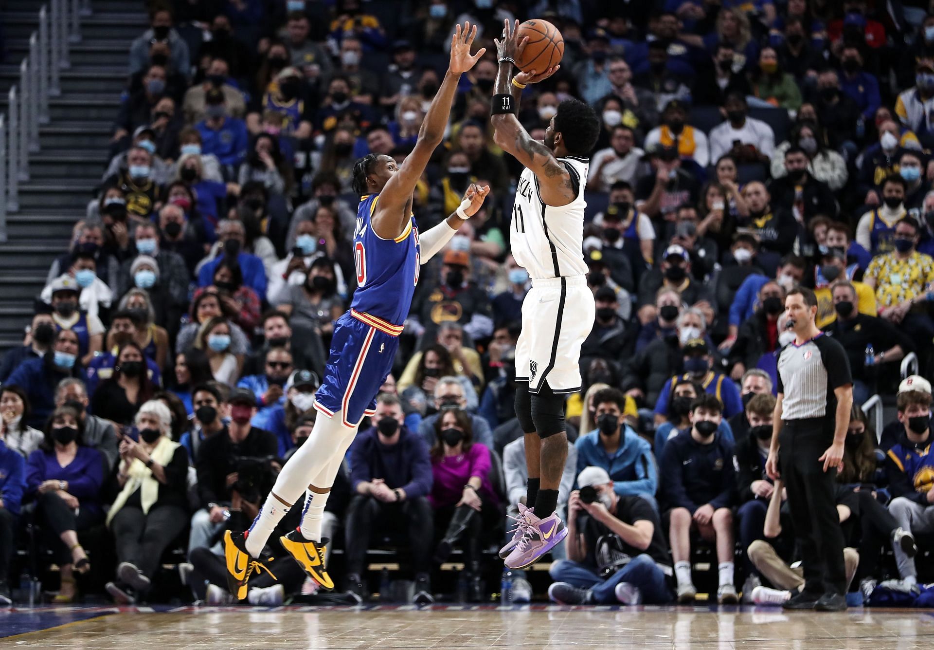 Jonathan Kuminga, left, and Kyrie Irving, right.