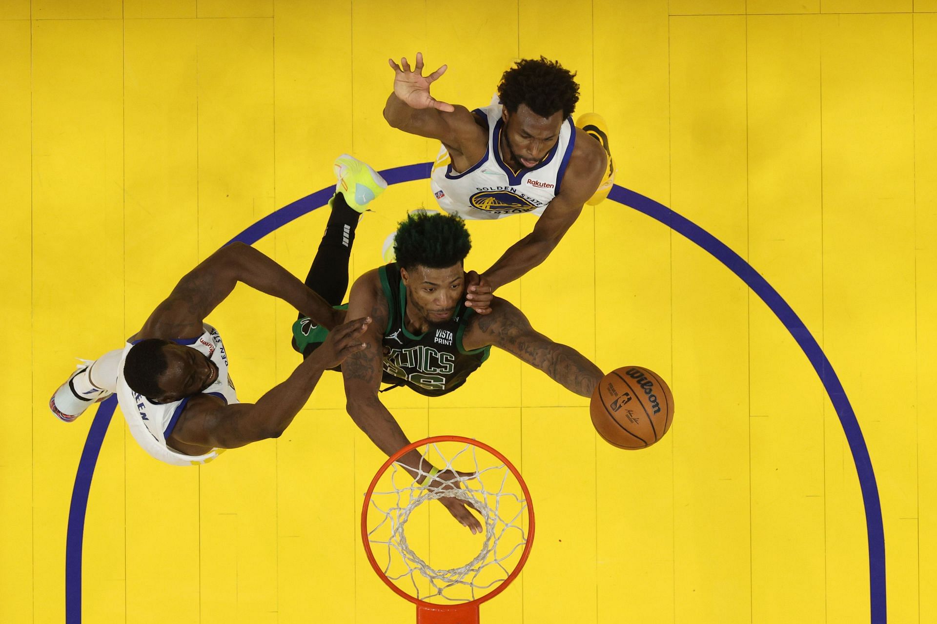 Green and Wiggins contesting a drive by Marcus Smart in Game Five