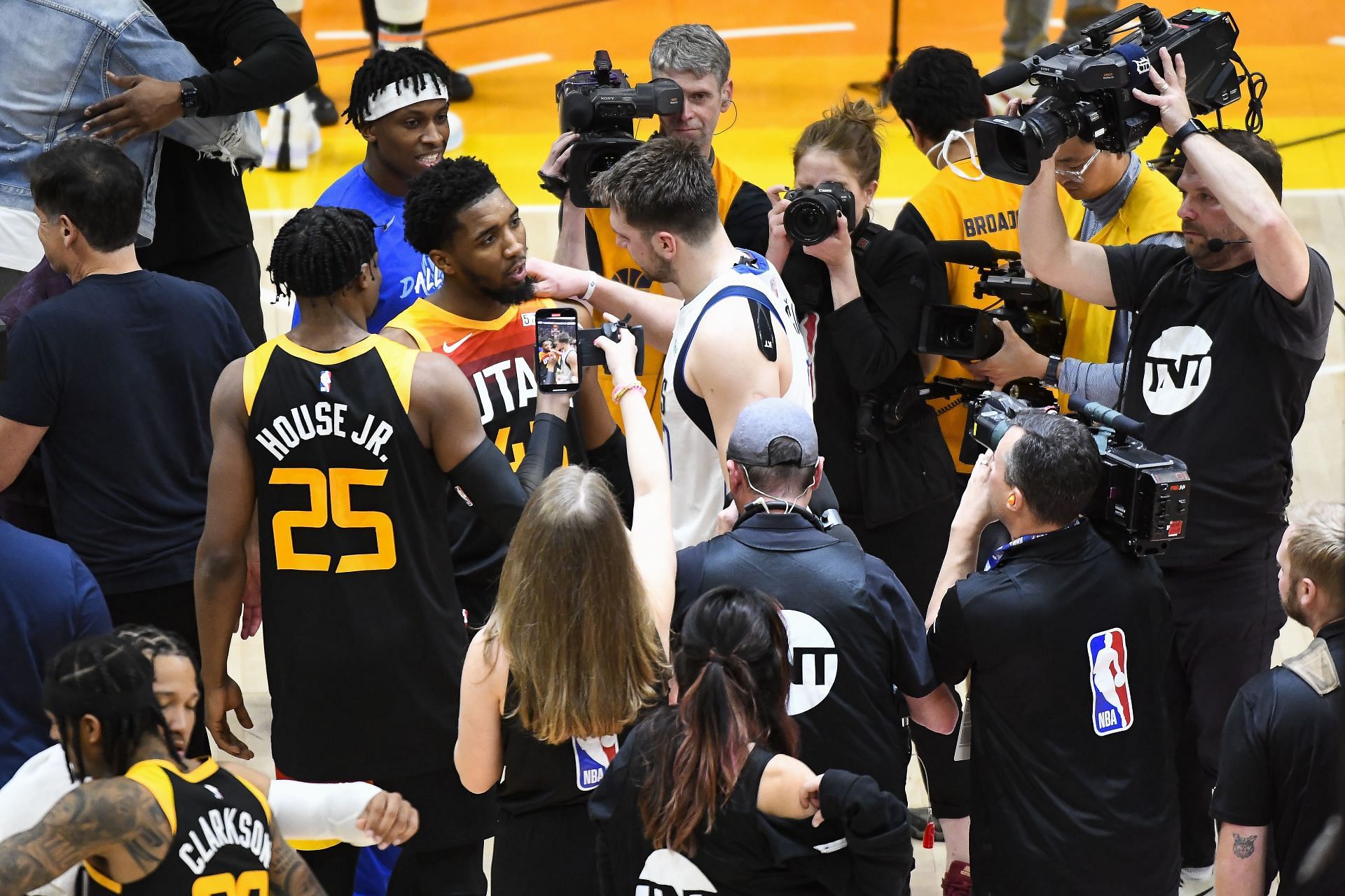 Donovan Mitchell in conversation with Luka Doncic.