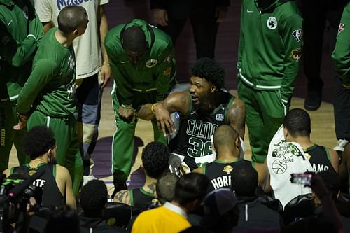 Marcus Smart (36) of the Boston Celtics talks with teammates at the end of the third quarter against the Golden State Warriors in Game 5 of the NBA Finals on Monday in San Francisco, California.