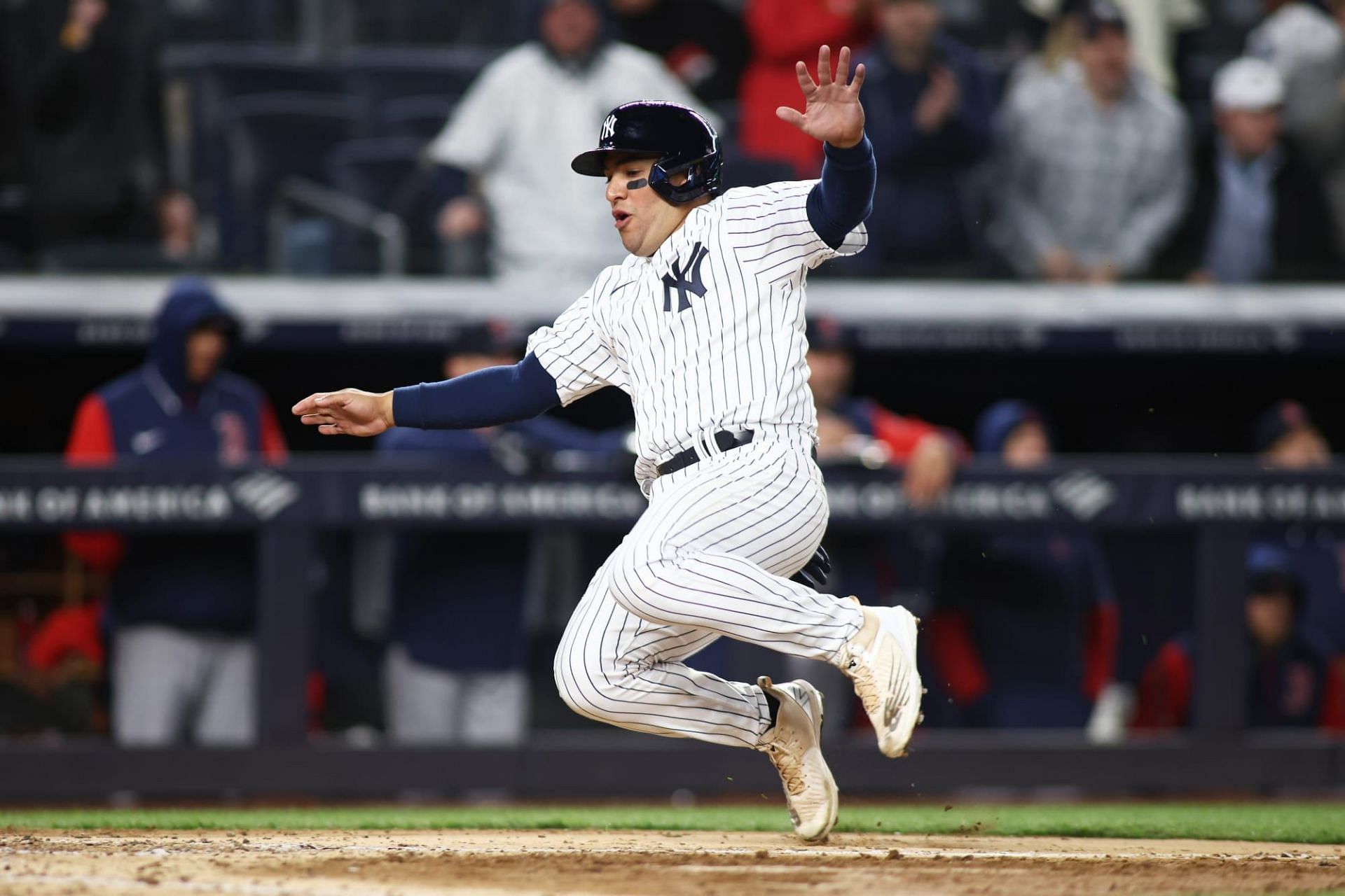 Jose Trevino makes an incredible slide at home plate to avoid a tag.