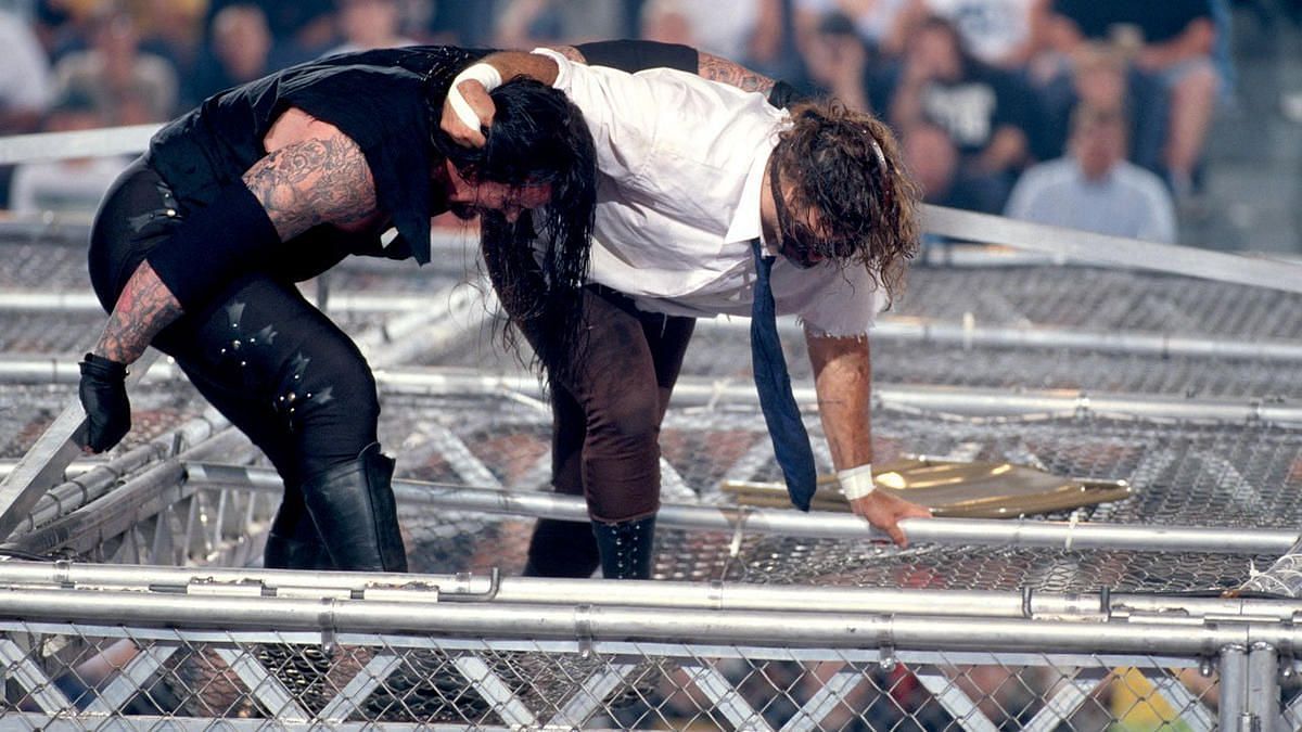 The Undertaker and Mankind at the top of Hell in a Cell: WWE King of the Ring 1998
