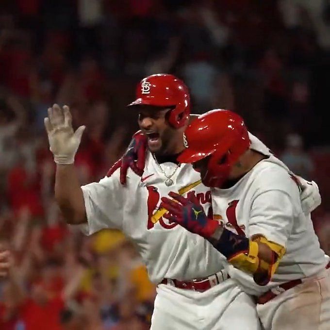 Lars Nootbaar grabs the pepper grinder after Albert Pujols hits